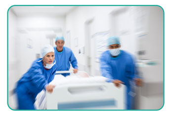 Nurse and doctor in a hurry taking patient to operation theatre.