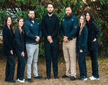 Physical Therapy Team smiling (four females and three males)